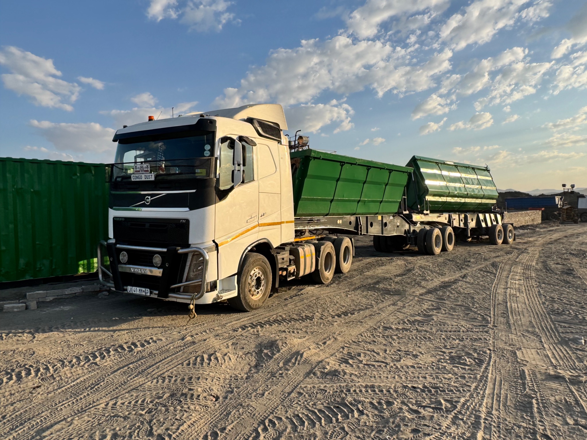 White truck with green trailer